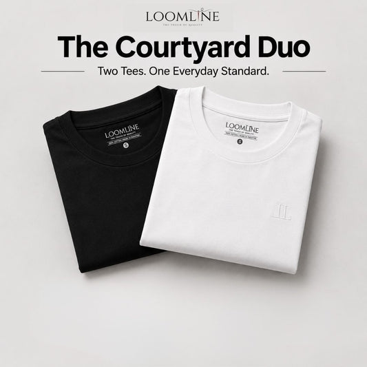Two neatly folded crewneck T-shirts from LOOMLINE, one black and one white, displayed on a light gray background with promotional text at the top reading 'The Courtyard Duo'.